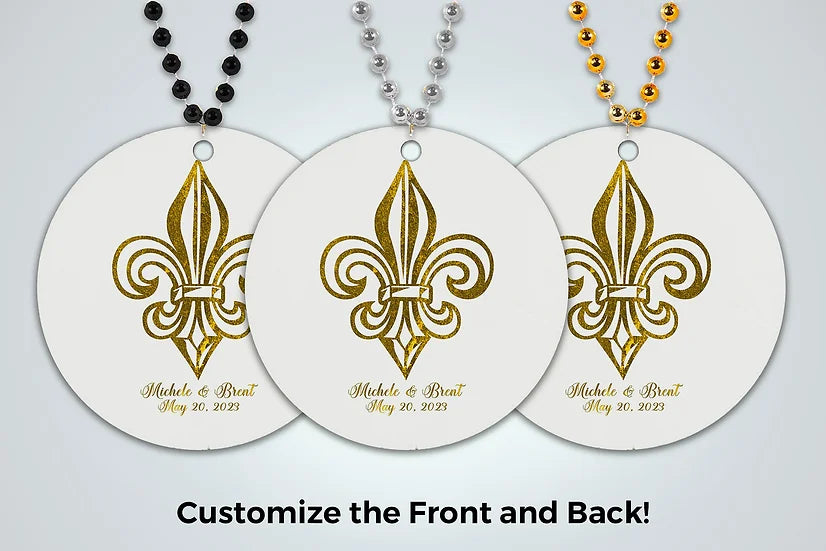 three necklaces with gold fleur de lis on them