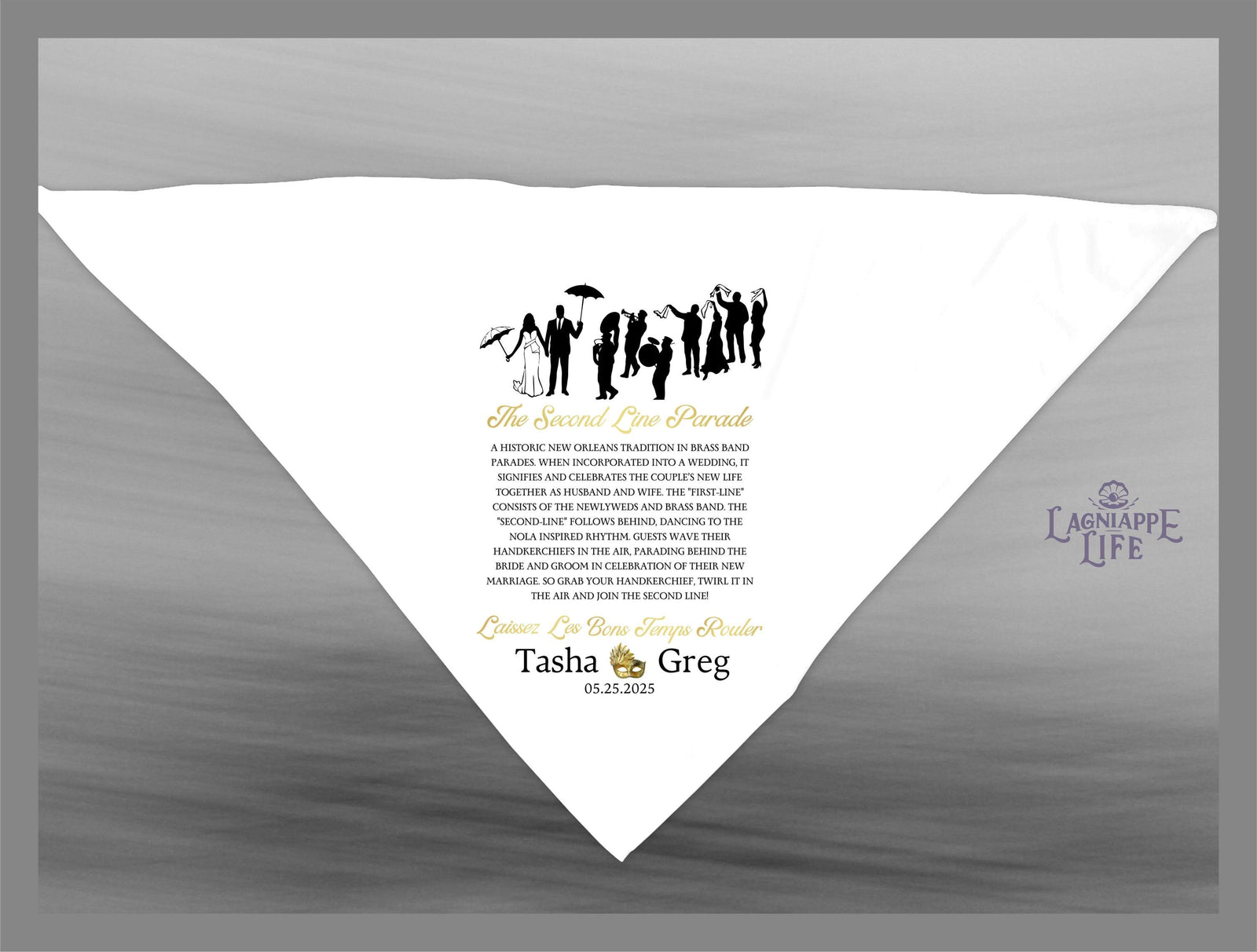 May include: A white wedding handkerchief with a black silhouette of a wedding party and a gold inscription that reads 'The Second Line Parade' and explains the tradition of the second line parade. The handkerchief also includes the couple's names 'Tasha' and 'Greg' and the date '05.25.2025'.