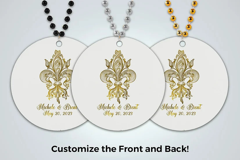 three white tags with gold fleur de lis on them