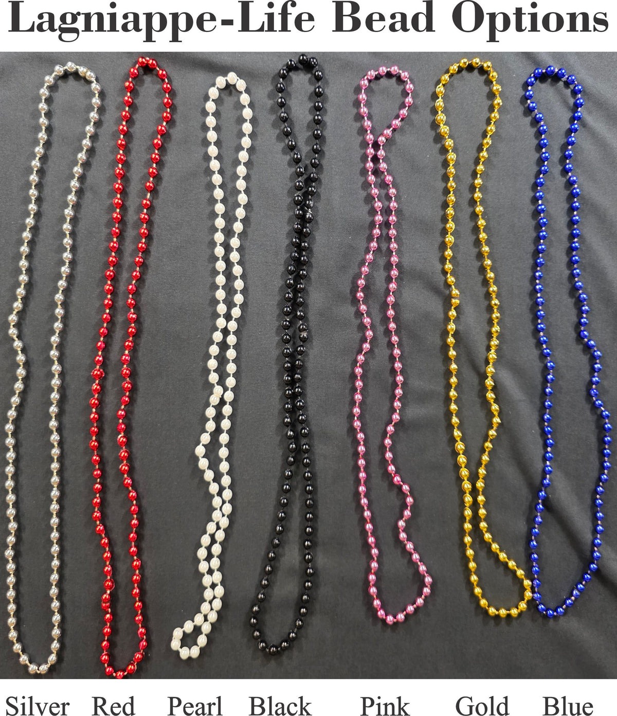 a group of beaded necklaces sitting on top of a bed