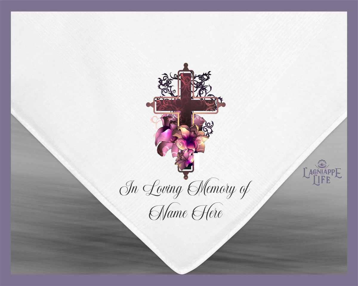 a white napkin with a cross and flowers on it